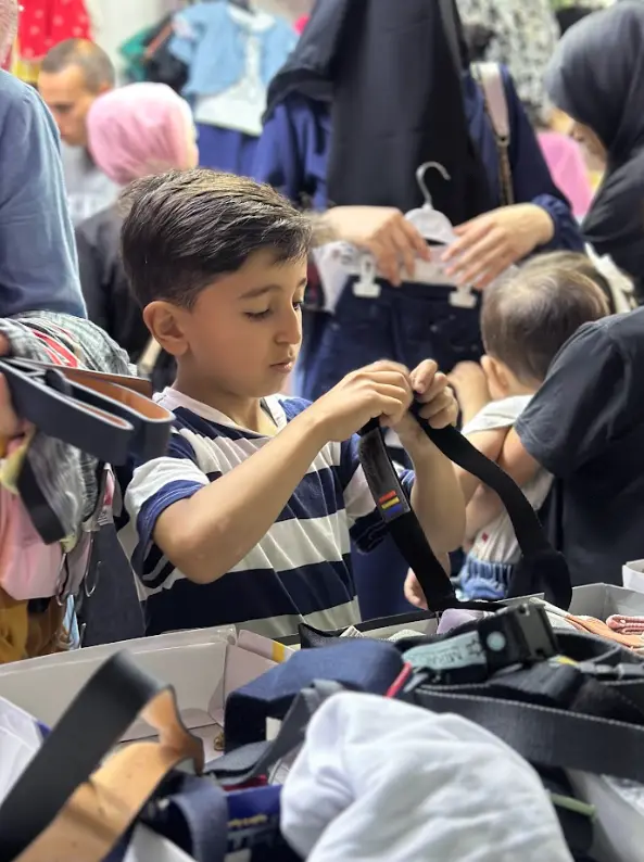Distribution of Clothing for Children during Eid Al-Adha despite War and Harsh Conditions